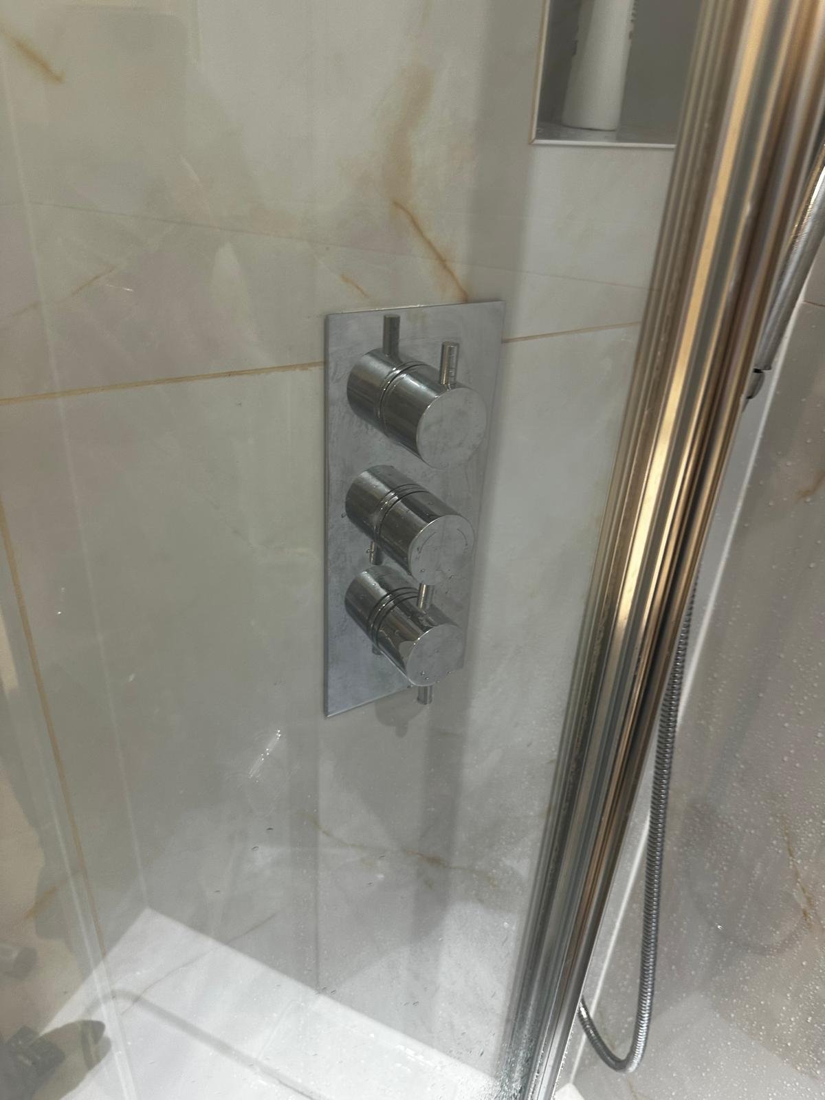 Full bathroom renovation with walk-in shower and vanity unit